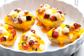 baked potatoes filled with cheese and bacon