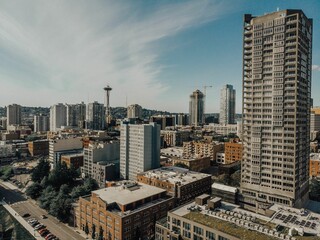 a view of the seattle skyline from atop a high rise apartment building
