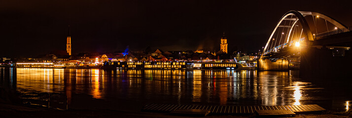 The swimming christmas market 2022 at night with reflections at Vilshofen, Danube, Bavaria, Germany