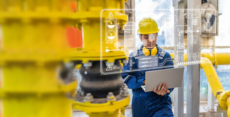 Maintenance technician at a heating plant,Petrochemical workers supervise the operation of gas and oil pipelines in the factory,Engineers put hearing protector At room with many pipes