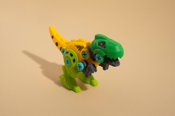 Plastic toy dinosaur on a light background