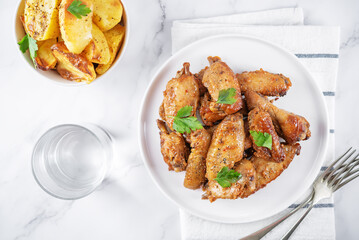 Spicy baked wings in a plate