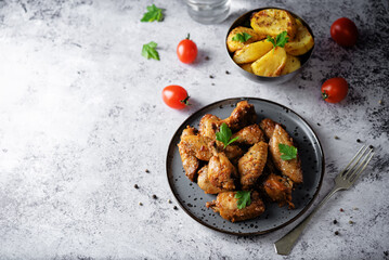 Spicy baked wings in a plate