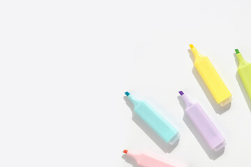 Colored markers on a white background. Top view; flat lay