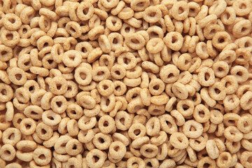 Beige oat cereal for a healthy cereal background