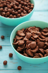 Set of various breakfast cereals on blue background. Vertical photo