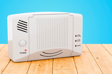 Carbon monoxide detector on the wooden table, 3D rendering