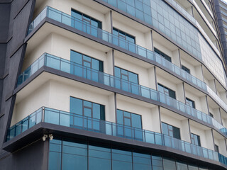 Facade of a modern blue house. New house. Windows pattern. Uninhabited housing.