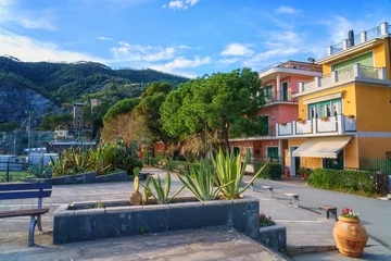 Foto op Canvas Scenic view of Monterosso al Mare, cozy seaside town in Cinque Terre National Park, beautiful cityscape with colorful houses, green trees and hills, Liguria region of Italy. Outdoor travel background © larauhryn