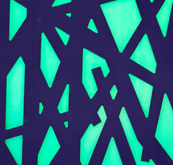 Fondo abstracto con formas lineales cruzadas en color azul, sobre tono verde azulado
