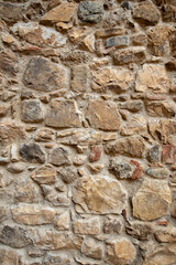 Texture of stone wall. Old castel wall, texture background. Tuscany, Italy