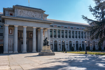 Fototapeta na wymiar Main facade of the Prado Museum with its neoclassical style in the tourist city of Madrid, Spain.