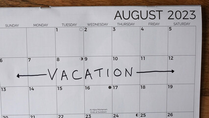 Summer vacation written on an August 2023 calendar. - obrazy, fototapety, plakaty