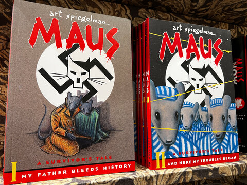 Copies of the graphic novels, Maus and Maus II, on a bookstore shelf. Written by Art Spiegelman, the books about the Holocaust have been banned in some libraries and schools.