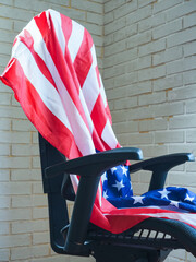 the concept of the presidential election in america the american flag on an empty chair