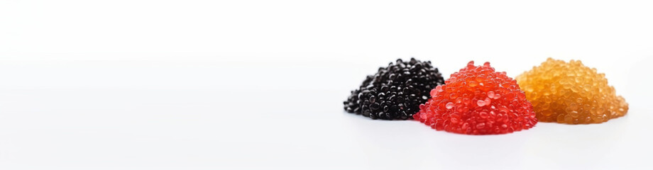 Black, yellow and pink sturgeon caviar in bulk on a white background. AI generated. Header banner mockup with space.