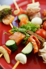 Tasty little snacks on sticks prepared for wine appetizer