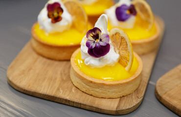 Shortbread tart cakes with dried lemons and cream. Delicious dessert food baked in a pastry cafe for lunch