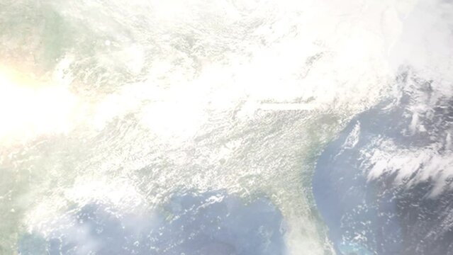 Earth zoom in from outer space to city. Zooming on Talladega, Alabama, USA. The animation continues by zoom out through clouds and atmosphere into space. Images from NASA