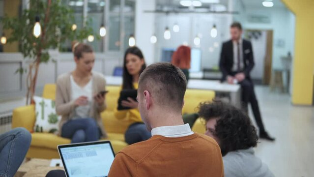 Young creative business people brainstorming at meeting at office