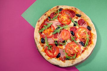 pizza with salami and tomatoes