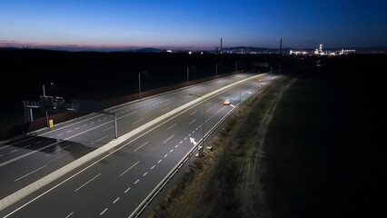 Fototapeta na wymiar empty highway at night with modern street lights