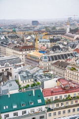 Fototapeta na wymiar Aerial view of Vienna central buildings on a cloudy summer day, Austria
