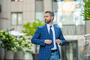 photo of charismatic business boss with tie. business boss outdoor. business boss