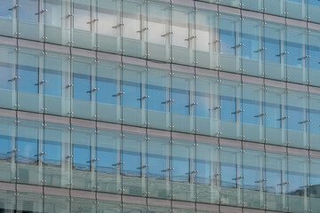 Plakat glass facade of a multi-storey building