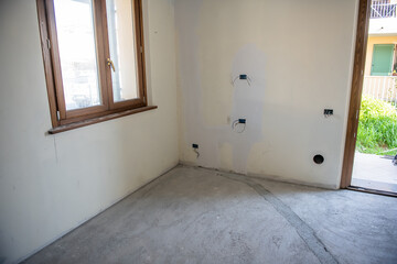 Laying the tiles on the floor. Moving to a new house concept. Living room