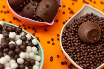 baskets of chocolate balls on an orange background