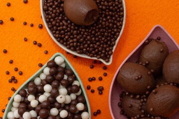 baskets of chocolate balls on an orange background