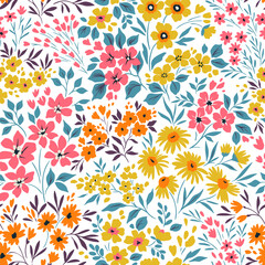 Vintage seamless floral pattern. Liberty style background of small pastel colorful flowers. Small flowers scattered over a white background. Stock vector for printing on surfaces. Abstract flowers.