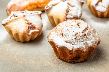 muffins and cupcakes sprinkled with powdered sugar, Food recipe background. Close up