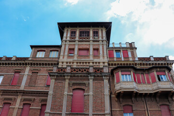 Fototapeta na wymiar Historic Roman Villa building front exterior built with red colored bricks in central Rome, Italy 