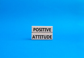 Positive attitude symbol. Concept words Positive attitude on wooden blocks. Beautiful blue background. Business and Positive attitude concept. Copy space.