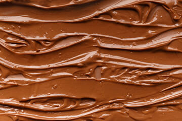 Chocolate background. Melted chocolate. Chocolate swirl.