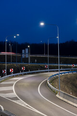highway crossroad at night with modern street lights