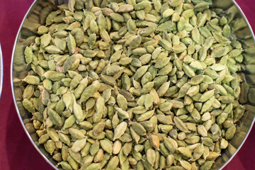 Cardamom seeds spice close up, view from above, selective focus. Organic food. Organic gardening