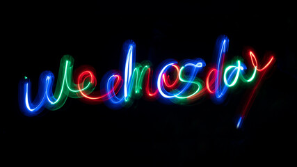 neon sign colorful wednesday lightpainting dark background glow in the dark