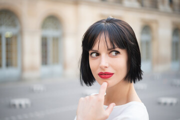 dreamy stylish brunette girl in the street. stylish brunette girl model. stylish brunette girl