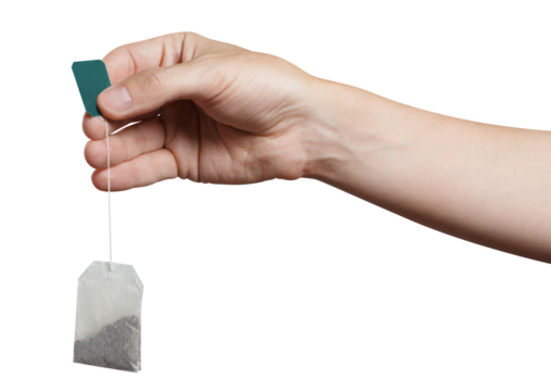 Hand holding a tea bag, cut out