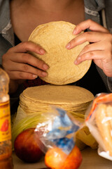 A woman with mexican tortillas 