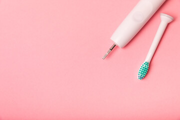 Smart electric toothbrush on a pink background.Modern technologies for health. Healthy teeth....
