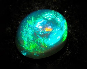 Natural precious stone noble opal on a black background