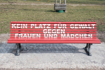 no place for violence against girls and woman - german text slogan on a park bench