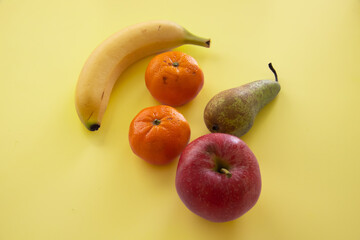 Top view of different fruits on colorful background