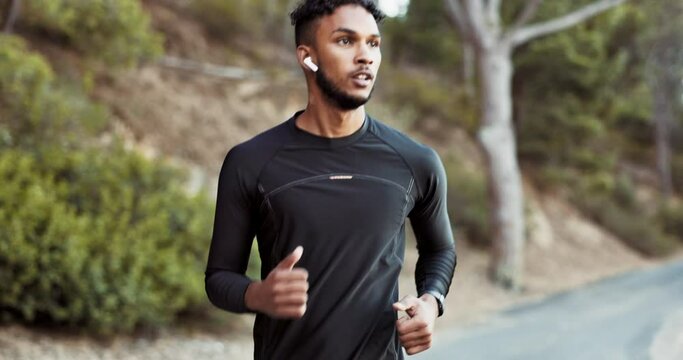 Running, exercise and man outdoor, wellness and training for marathon, competition and healthy lifestyle. Male athlete, guy and runner in street, fresh air and balance for cardio, power and energy