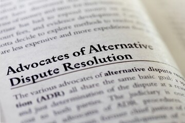legal or law book with Advocates of alternative dispute resolution ADR focused in closeup of...