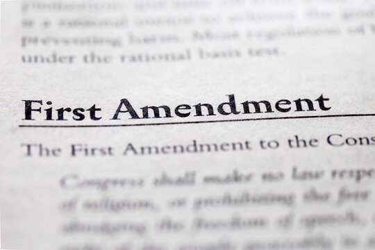 legal or law book with first amendment freedom of speech, religion, assemble, press and petition from Bill of Rights 1791 focused in closeup of explanation